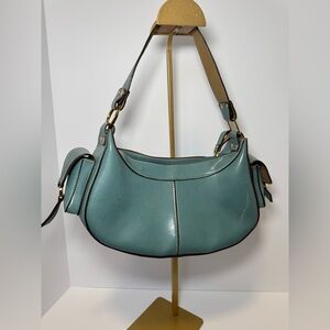 Stylish Mondani New York shoulder bag features a vibrant teal blue-green